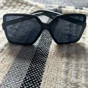 Black oversized sunglasses, dark lenses